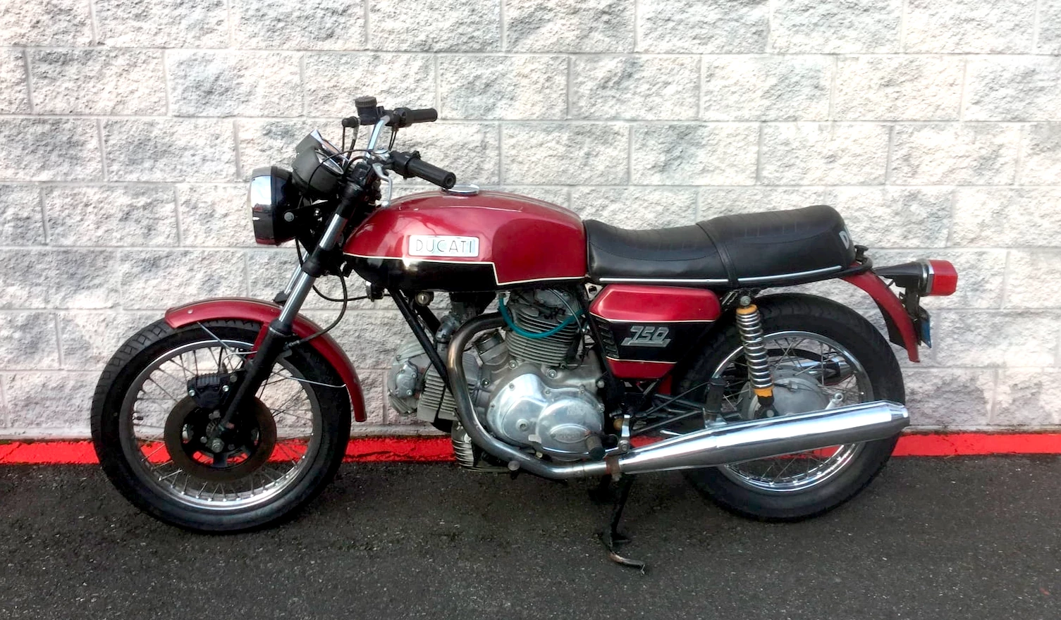 There is something about the Ducati name on the auction block that seems to multiply pricing just by the way it rolls off the tongue. The Ducati 750 SS is now selling into the stratosphere (like this one for $150,000), and the Ducati 750 S followed suit with pricing climbing at an extraordinary rate thanks to the rising tide caused by the 750 SS. Now the 750 GT is doing likewise. This unrestored model fetching $17,050 is a sign for the future methinks.