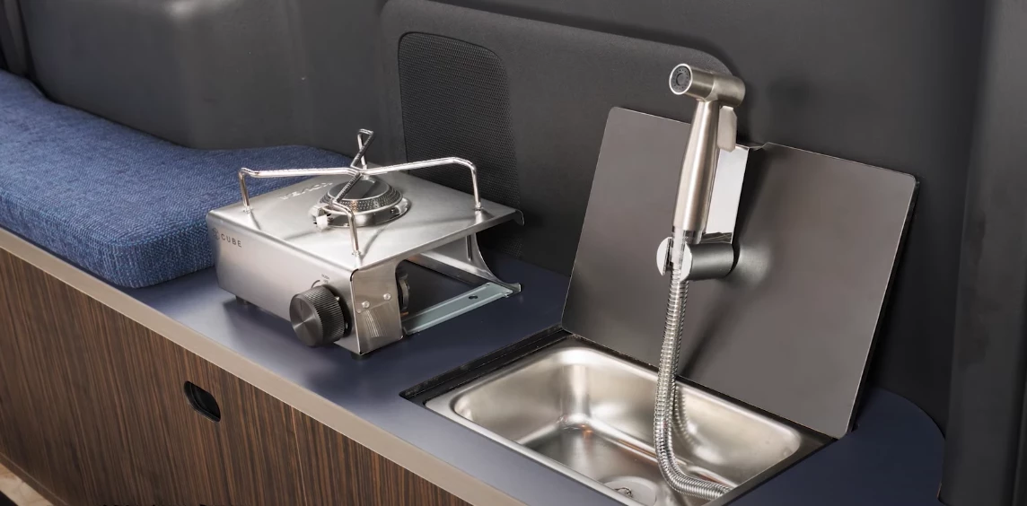 The UI Freestyle 7 looks like a sleeper van at first but hides a tiny rear kitchen below the bed cushions