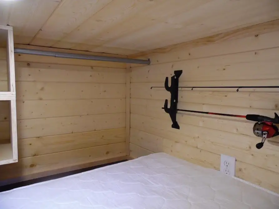 The Man Cave features gun racks and fishing gear