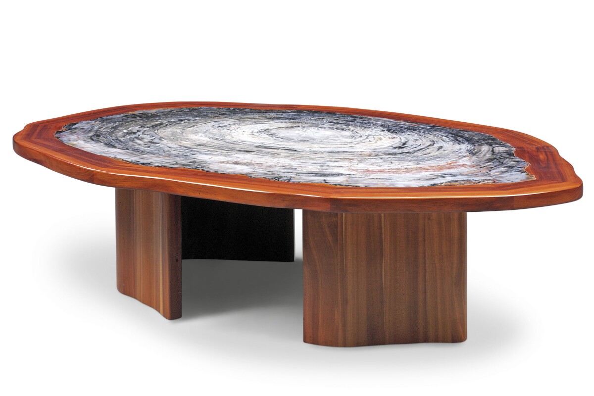 This magnificent table measures 571⁄2 x 411⁄2 x 153⁄4 inches (146 x 105 x 40 cm) and the tabletop is a thick slice of petrified Araucarioxylon arizonicum wood that is 225 million years old.