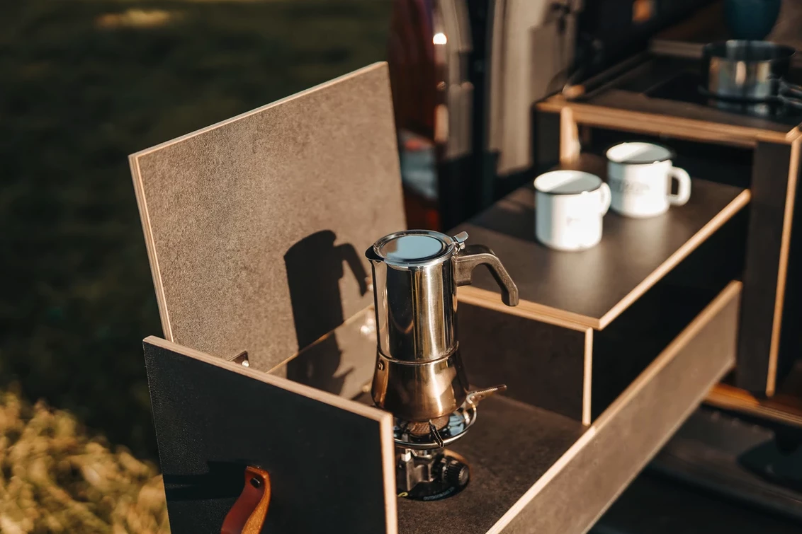 The compact portable gas stove cooks on the van and removes for use on the go