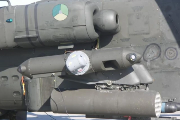 The small pod containing Northrop Grumman's laser Directional Infrared Countermeasures (DIRCM) system mounts to the end of the stub-wing on the Apache AH-64D attack helicopter. The system successfully thwarted a series of simulated heat-seeking missile at