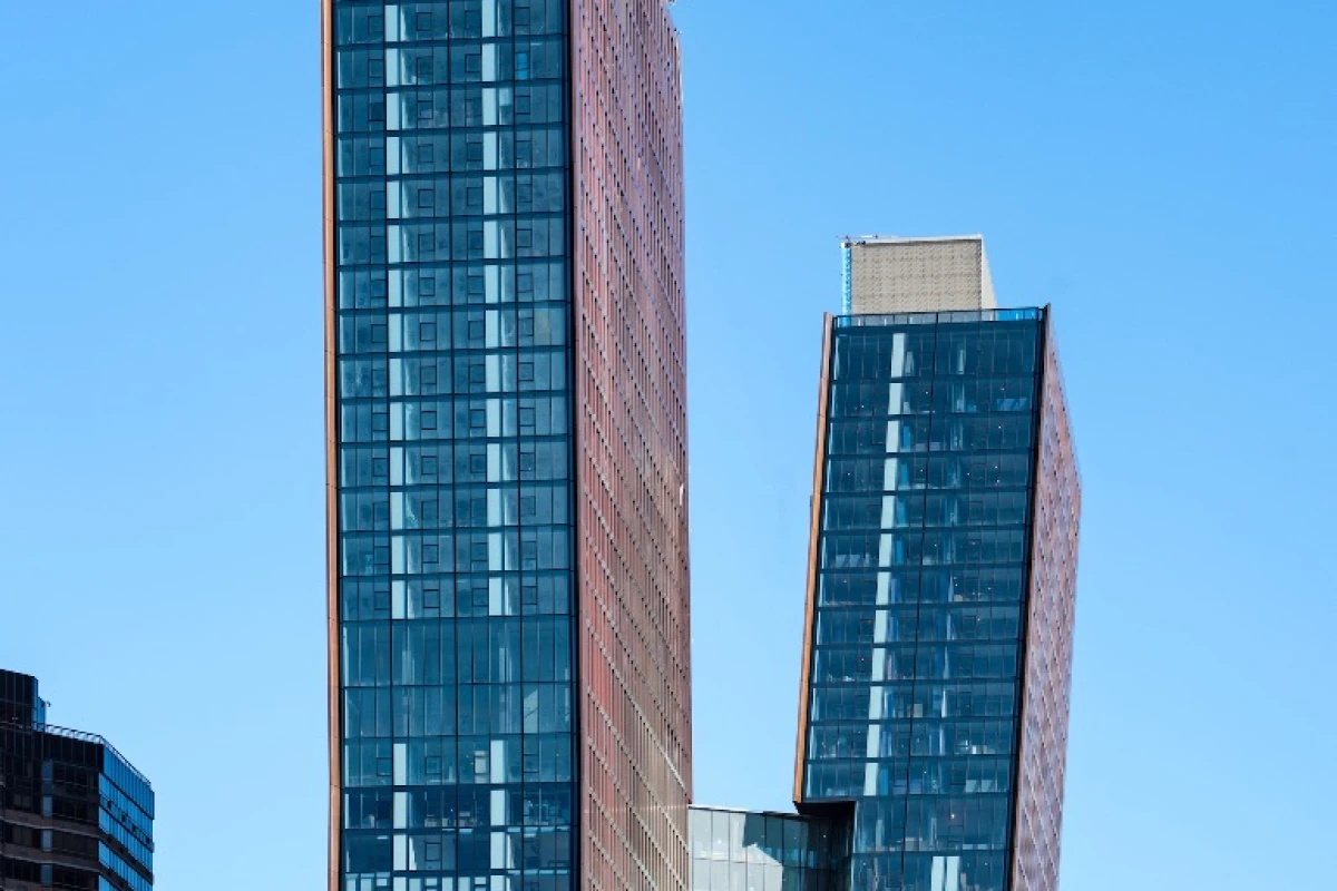 The American Copper Buildings are connected by a sky bridge which includes amenities like a lap pool and hot tub