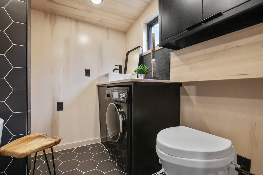The Sangja's bathroom features a composting toilet, sink, and a washer/dryer