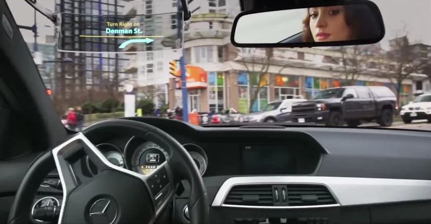 Iris replaces the car's existing driver's-side windshield visor