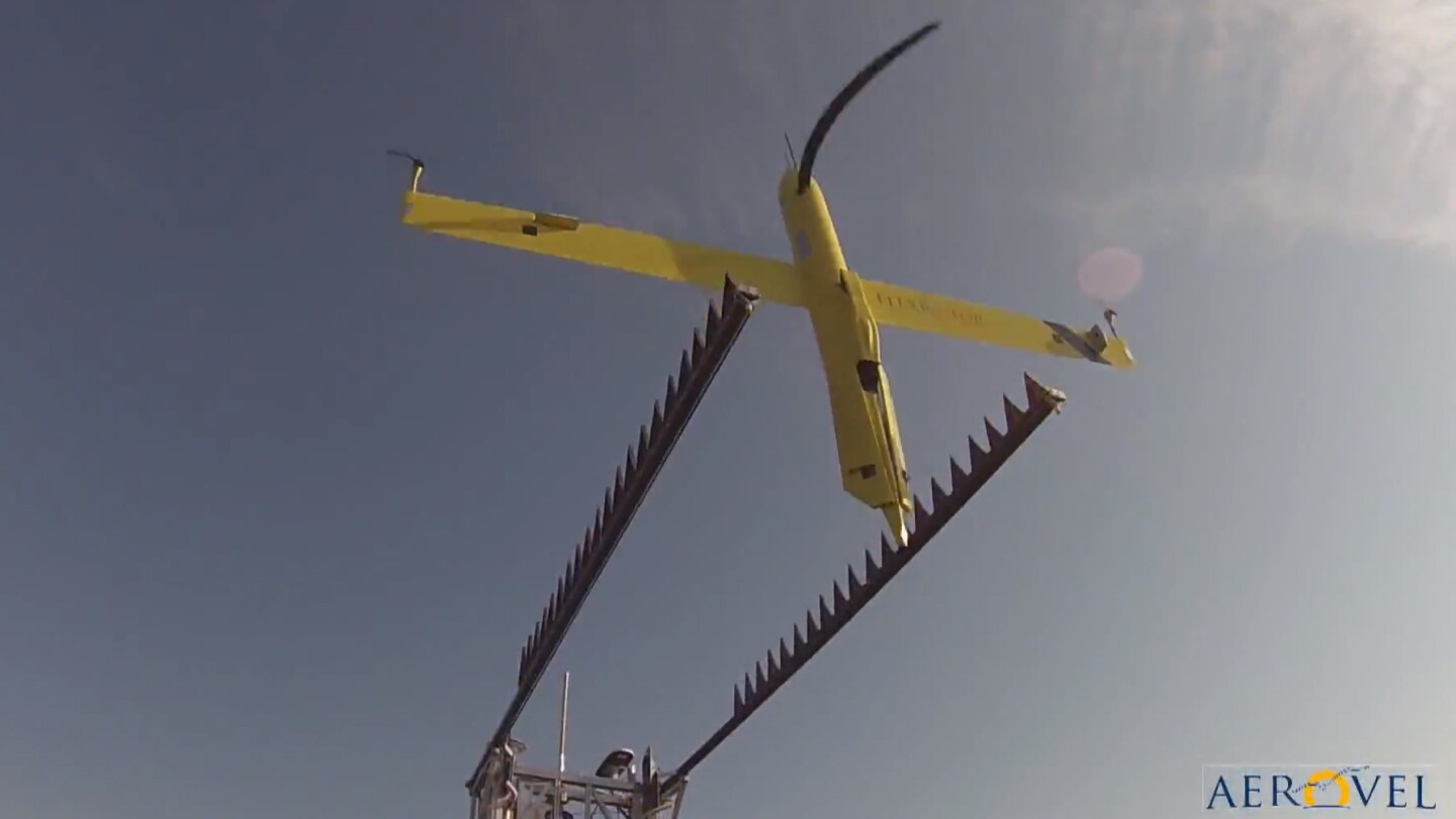 The Flexrotor taking off for its second flight after refueling - the propeller appears bent due to the camera's rolling shutter