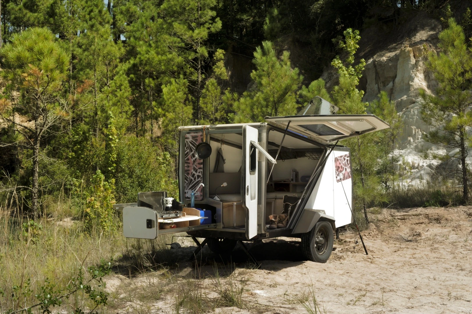 The under-coach slide-out can hold kitchen equipment or other gear