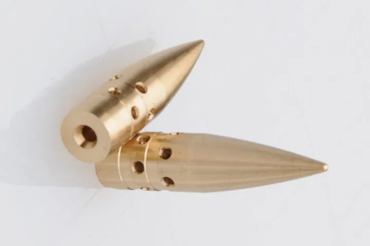 CompBullets are claimed to go faster than regular bullets, due to vents that have been machined into their sides