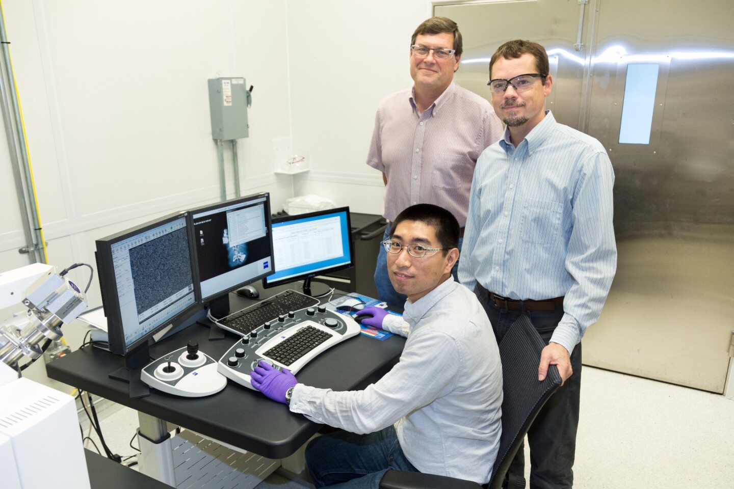 The ORNL researchers involved in the CO2-to-ethanol conversion research: Yang Song (seated), Dale Hensley (standing left) and Adam Rondinone