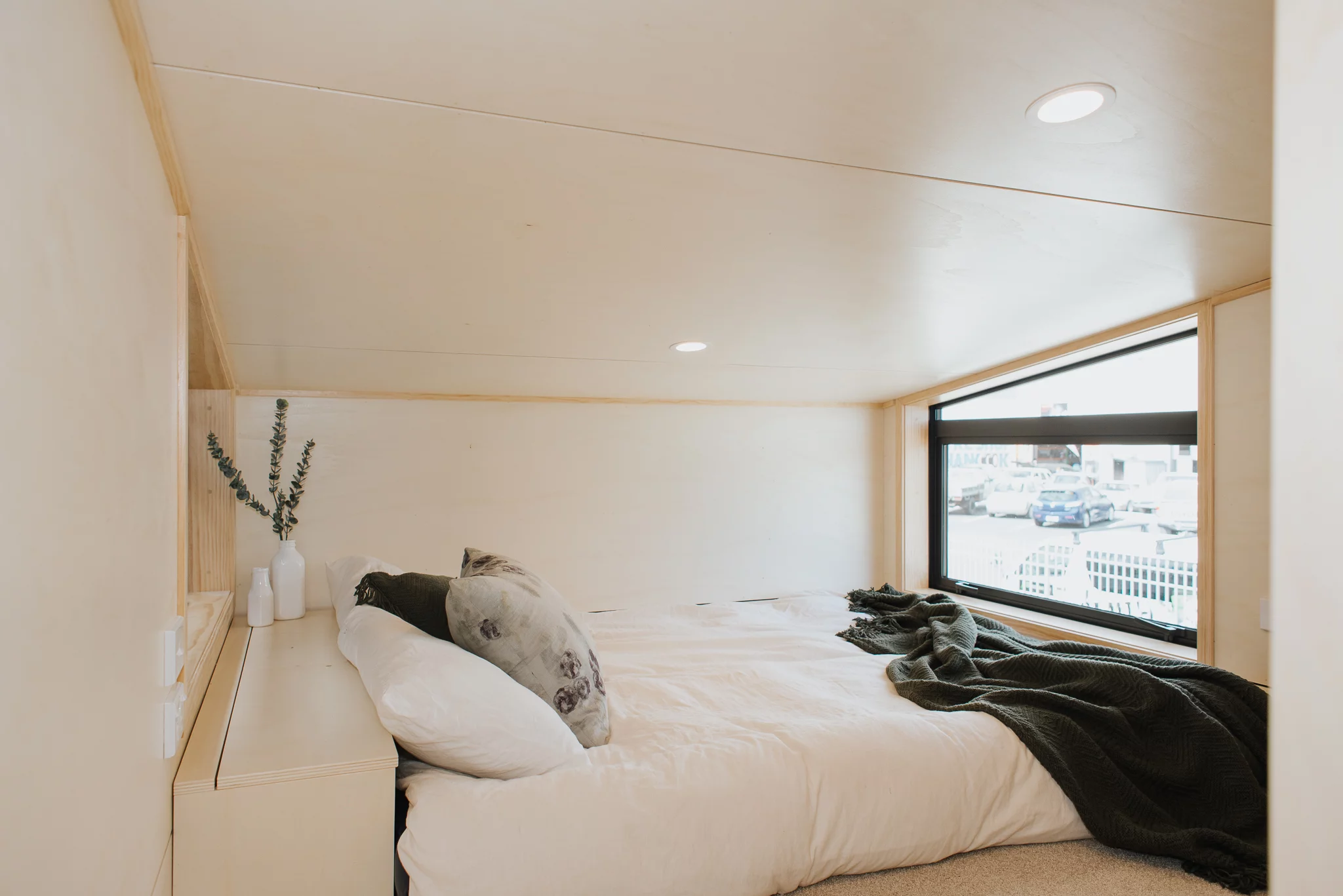 The Hilltop Tiny House contains one bedroom, which is a typical tiny house-style loft bedroom with a low ceiling