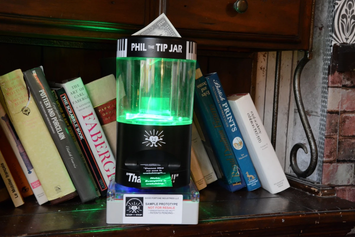 A battery-powered Phil the Tip Jar waits patiently for loose change or notes to be dropped in its money slot