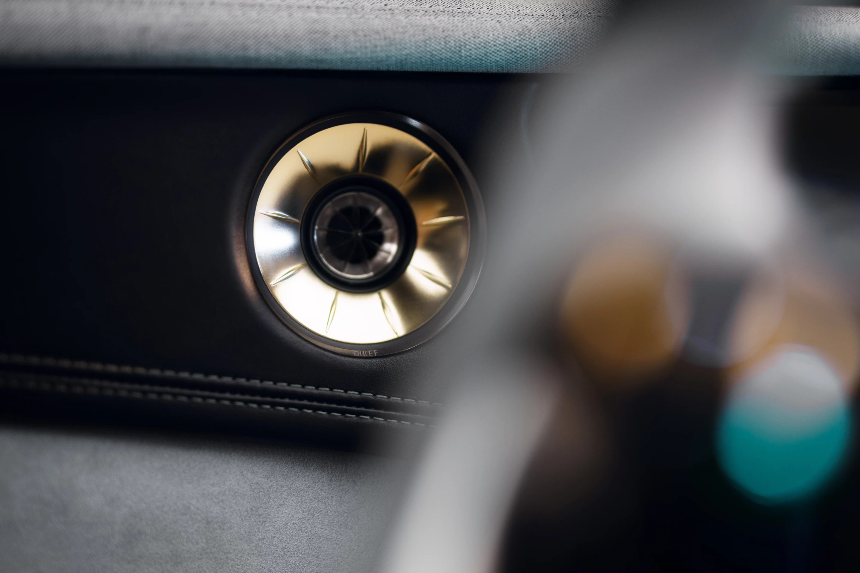 Lotus uses partially exposed door speakers with both KEF audio system options, adding a distinctive design element
