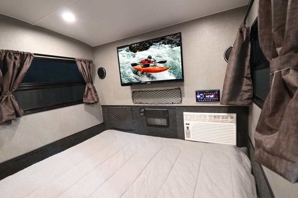The Luna Rover will share its basic interior layout with the Luna Lite pictured; however, it will have window shades in place of curtains