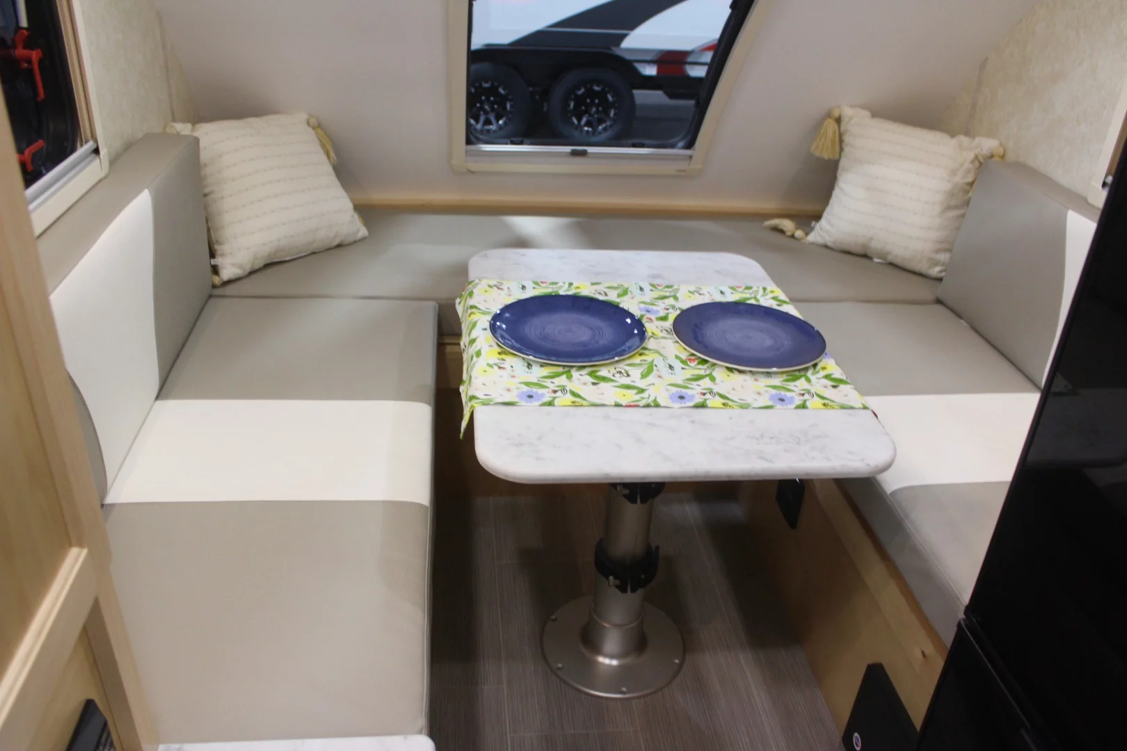 The Little Guy Mini Max does a lot with a little, packing in a convertible dinette (queen/double twin) bed, corner wet bath, full kitchen area (with microwave), storage and TV. It sleeps two adults or a family of three