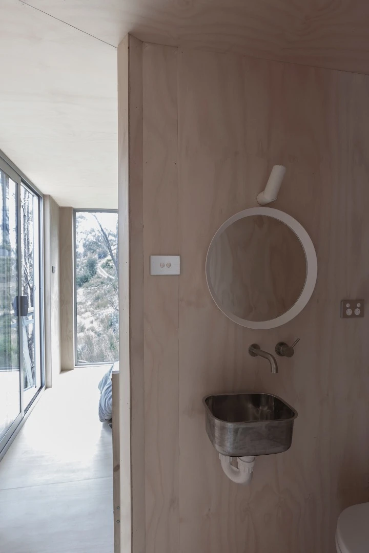 House 28's interior is simply furnished in marine-grade ply