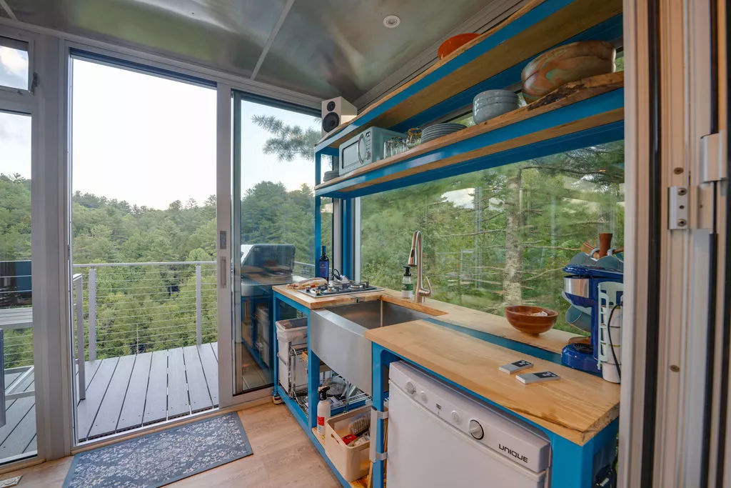 The River Forest Lookout’s kitchen is quite basic and contains a sink, mini-fridge, microwave, and a two-burner propane-powered stove