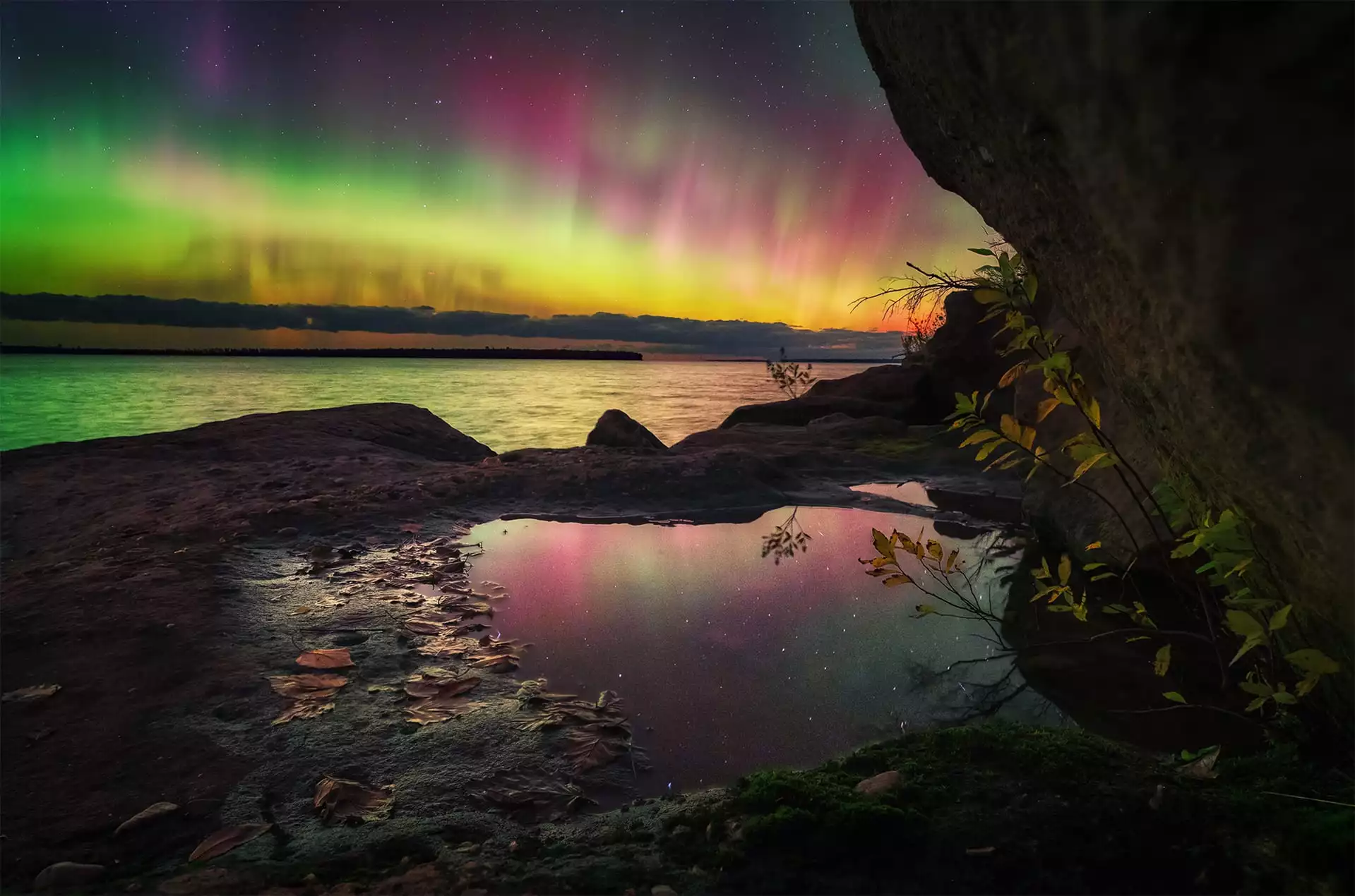 Aurora Sherbet in the Apostles by Marybeth Kiczenski, shot in Wisconsin, US. After seeing reports of a coronal mass ejection and M-class solar flare, the photographer drove eight hours north to escape cloud cover. The end result was worth it, with a wide range of colors and a beautifully composited image.