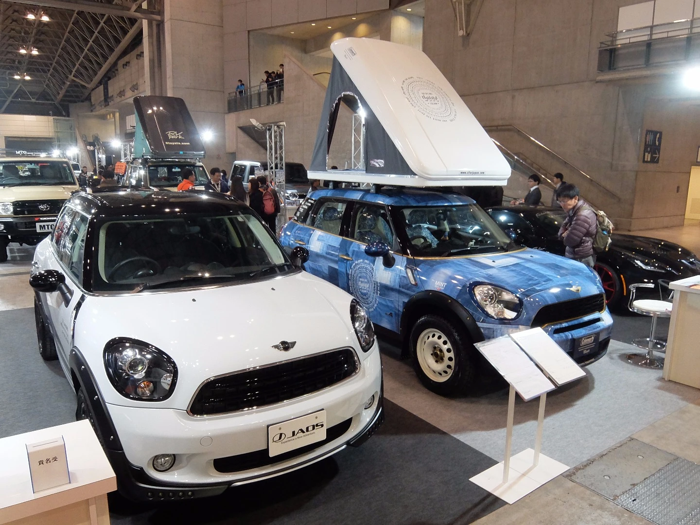 Two MINI Crossovers (Countryman) modified by JAOS, with raised suspension and, on the left, blue jeans paintwork