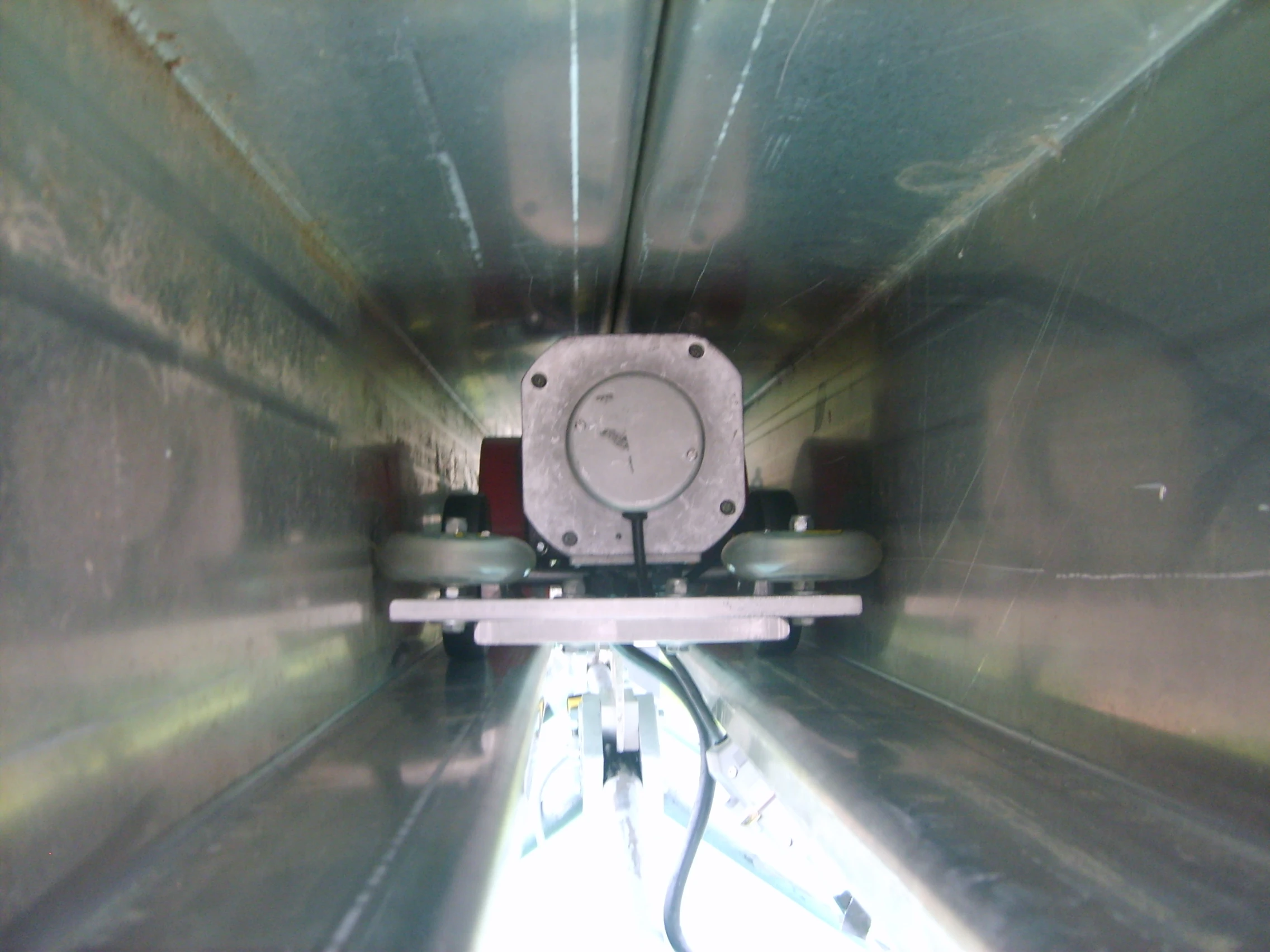 The demo model's bogie sits inside the overhead rail track
