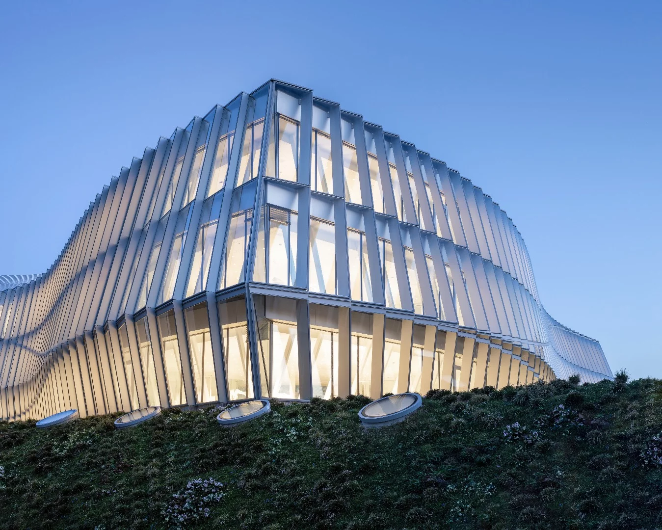The Olympic House is defined by its glazed facade
