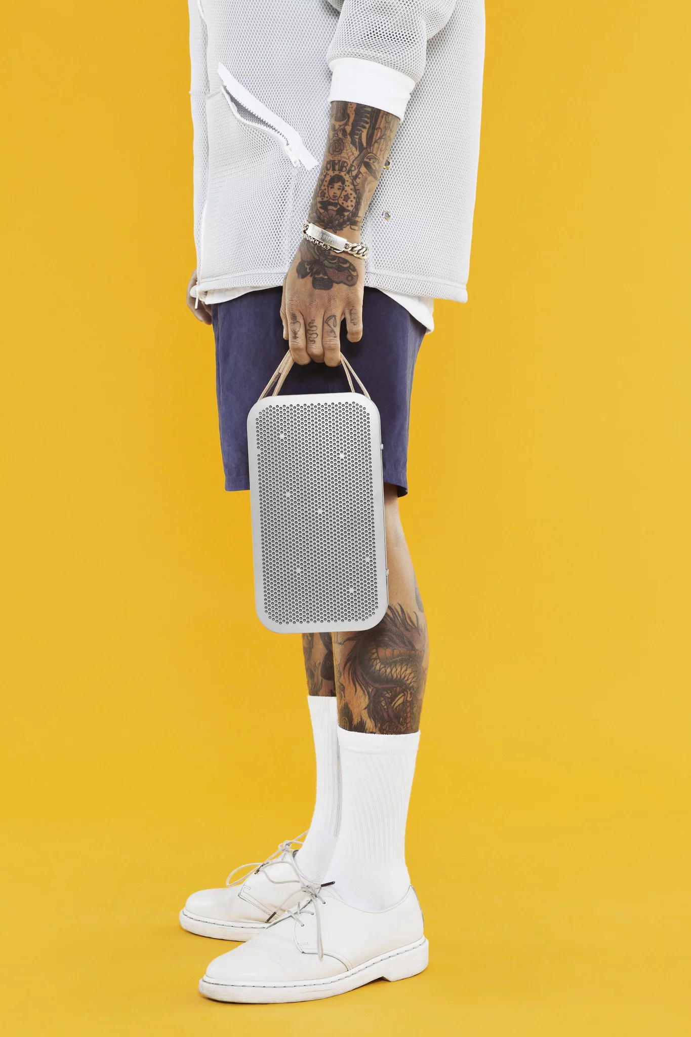 It features a short leather strap for carrying
