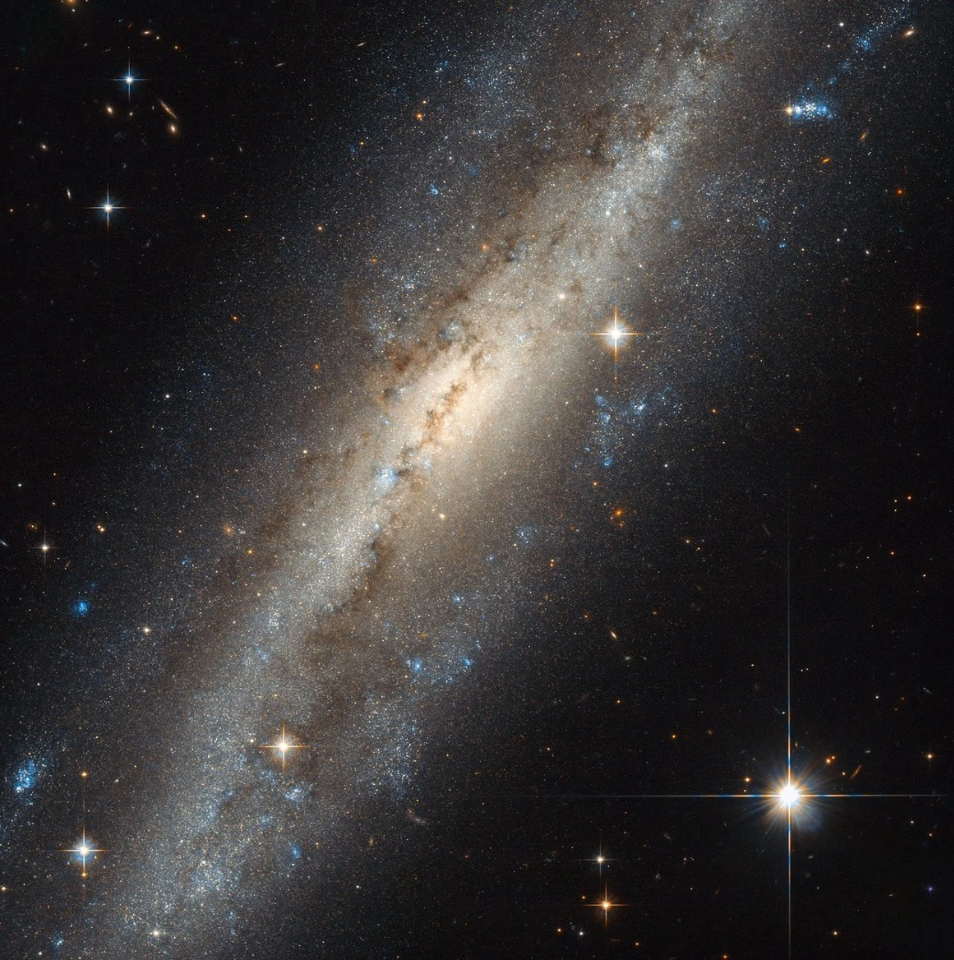 NGC 7640 is a barred spiral galaxy