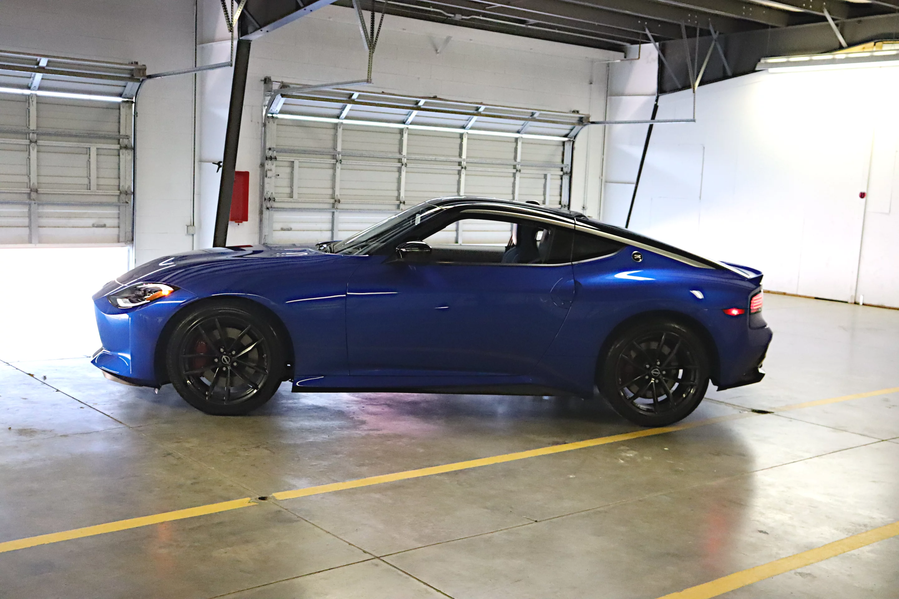 The 19-inch Rays super lightweight, forged aluminum-alloy wheels stand out in the side profile of the 2023 Nissan Z Performance