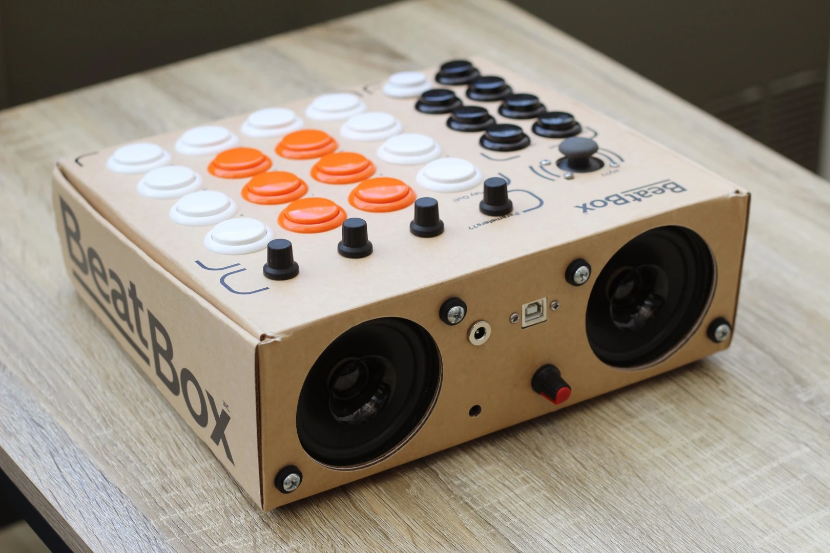 The Beatbox comes with mechanical arcade-style buttons, a joystick, parameter knobs, two 50 W speakers, a Teensy dev board and a battery pack