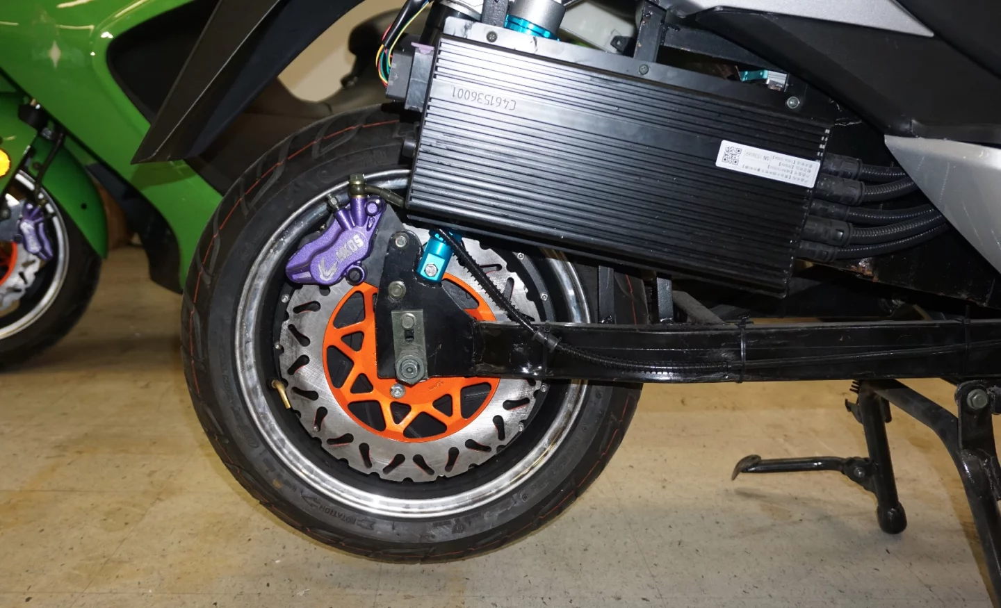 ZEV LRC-T15: chunky rear hub motor and disc brake, showing extended swingarm as well as the finned motor controller