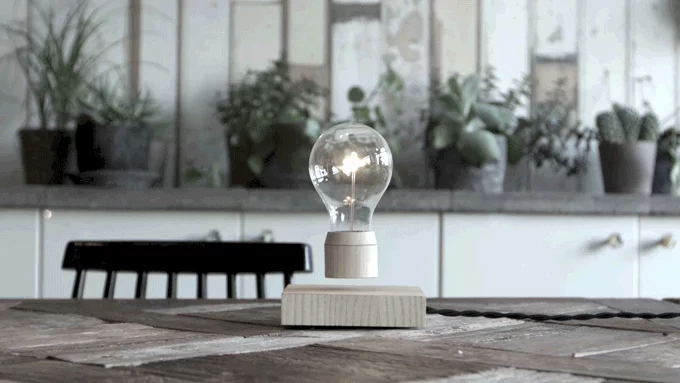 The Flyte lightbulb uses magnetic levitation and induction charging to hover wirelessly above its base