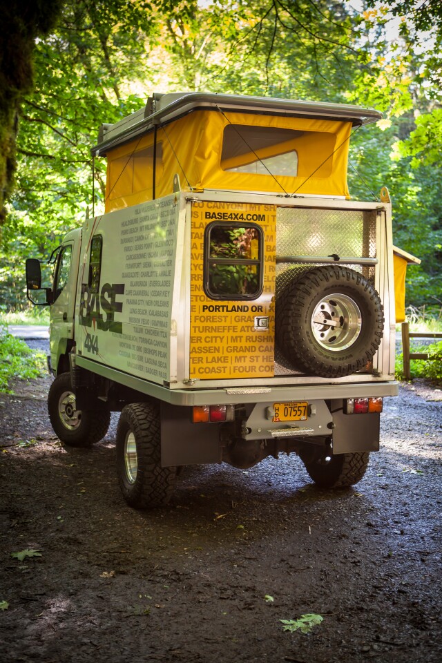 The small door is designed for regular entry/exit, while both doors open together for loading motorcycles and other gear