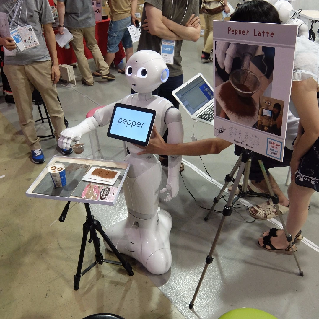 Pepper the robot puts a self-portrait on a cup of coffee