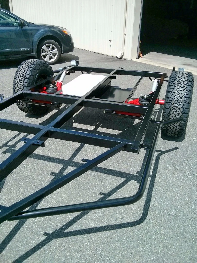 A rectangular tubular steel frame and dual trailing arm suspension help stand up to the terrain