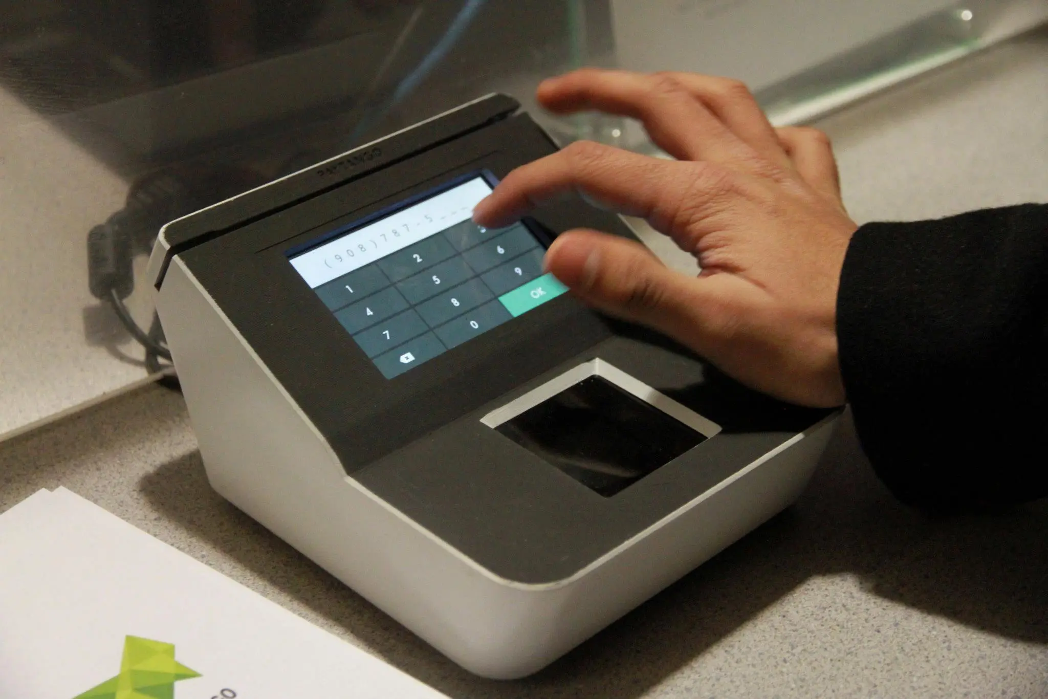 Sign up involves touching the biometric scanner with an index and middle finger, swiping a credit card through a reader to associate it with your unique ID and then punching in your cellphone number