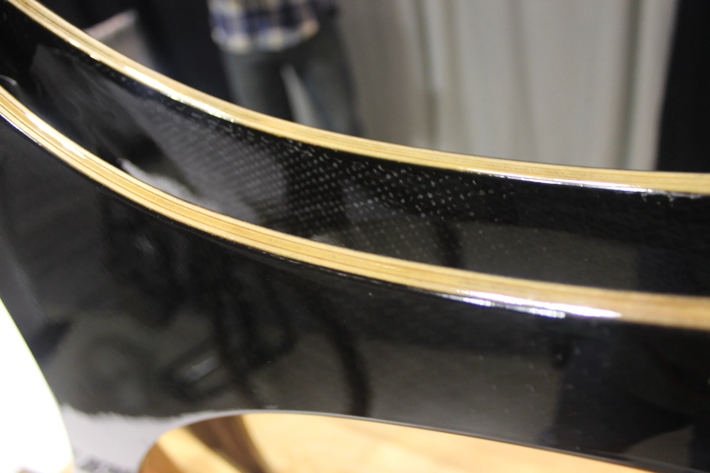 The frame is made from three layers of laminated plywood, covered in carbon fiber