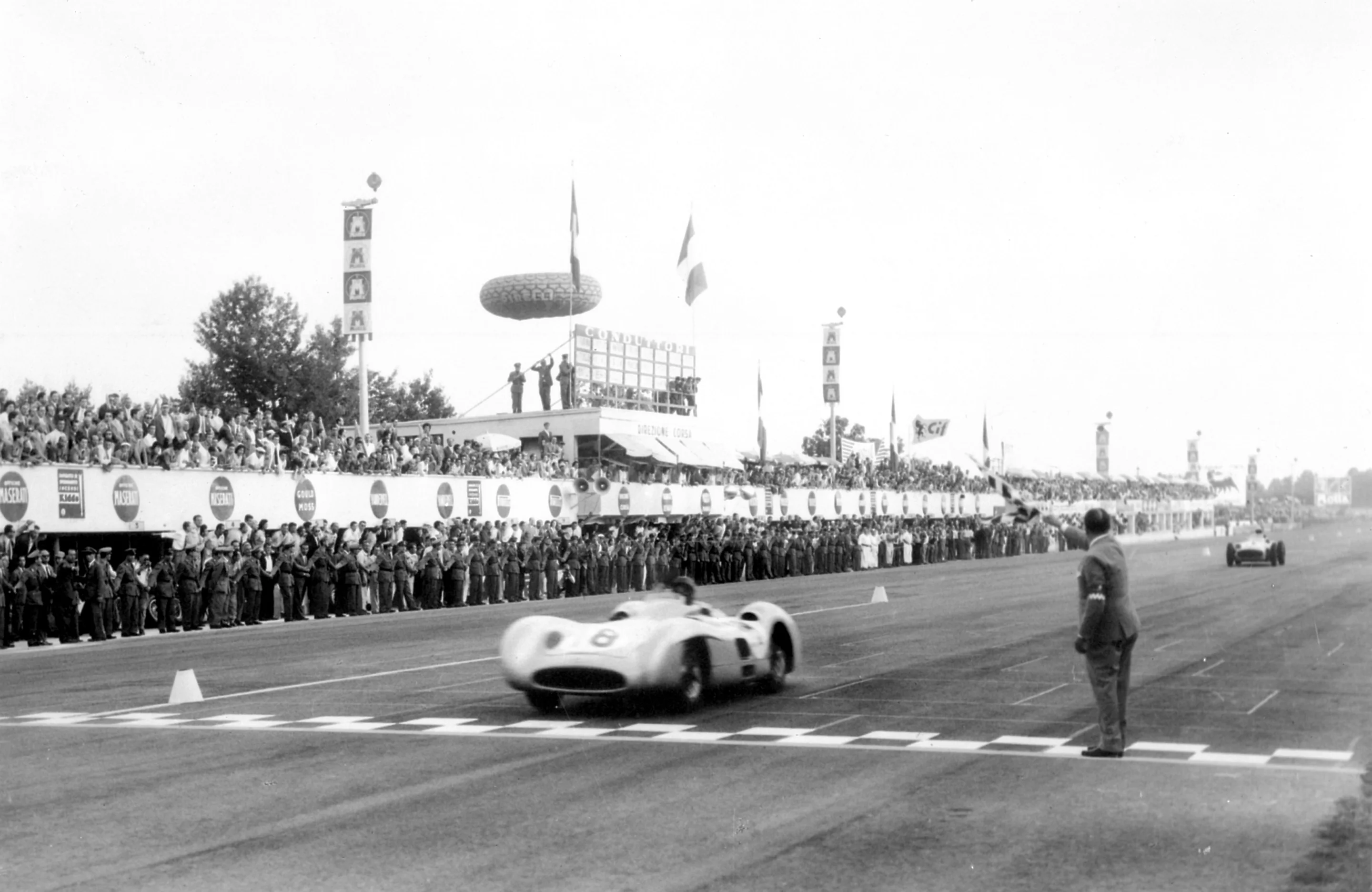 The last win for the Silver Arrows was this one - Fangio takes the flag at the 1955 Italian Grand Prix at Monza, on September 11, 1955.