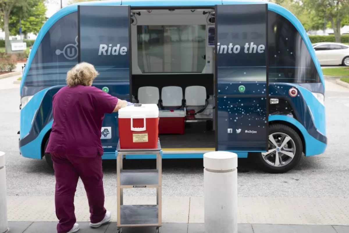Once the testing is complete, workers load the samples into a secure container and place them aboard the autonomous shuttle