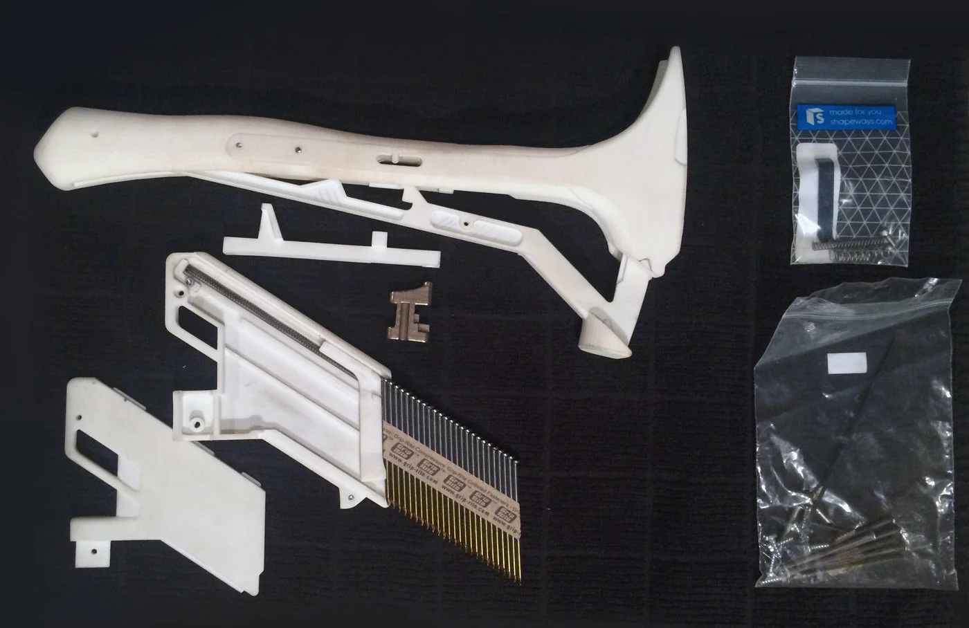 Michael Young's single-handed hammer uses a loading mechanism to dispense nails from its head
