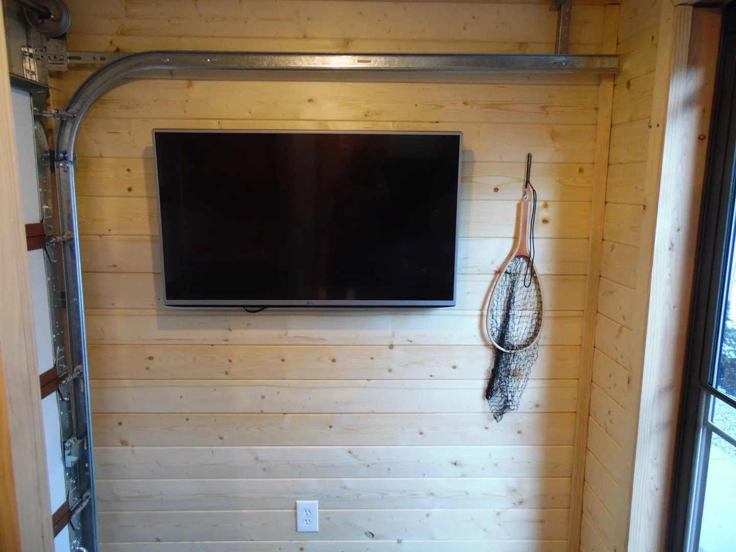 The wall-mounted TV