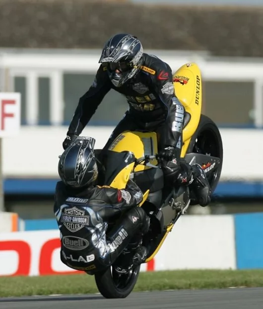 Craig Jones (riding) and Wing Chui (front wheel) breaking the world record at Donington.