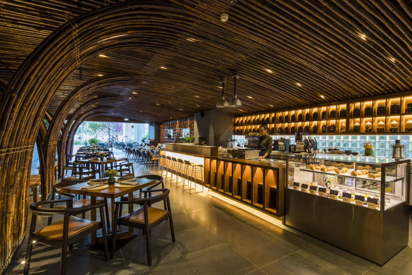 Chicland Hotel's decor is made up of natural materials like wood, stone, bamboo, and rattan