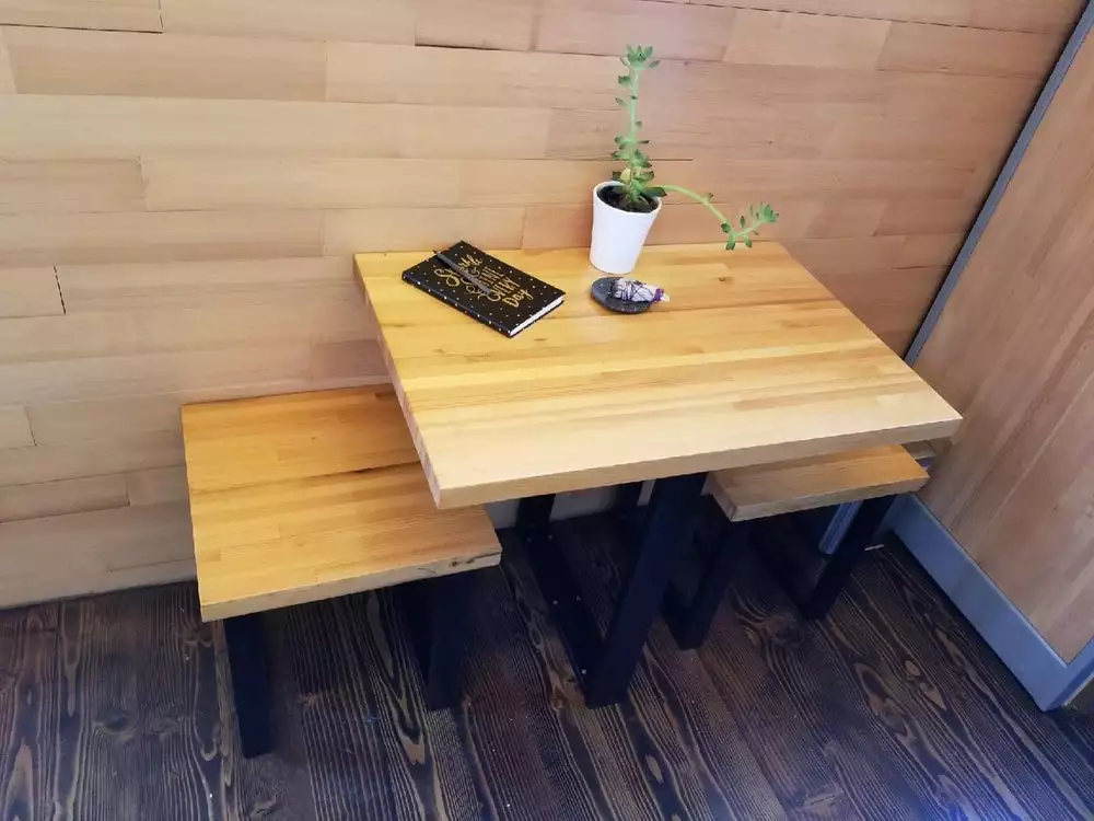 The True Studio includes a dining table with two seats