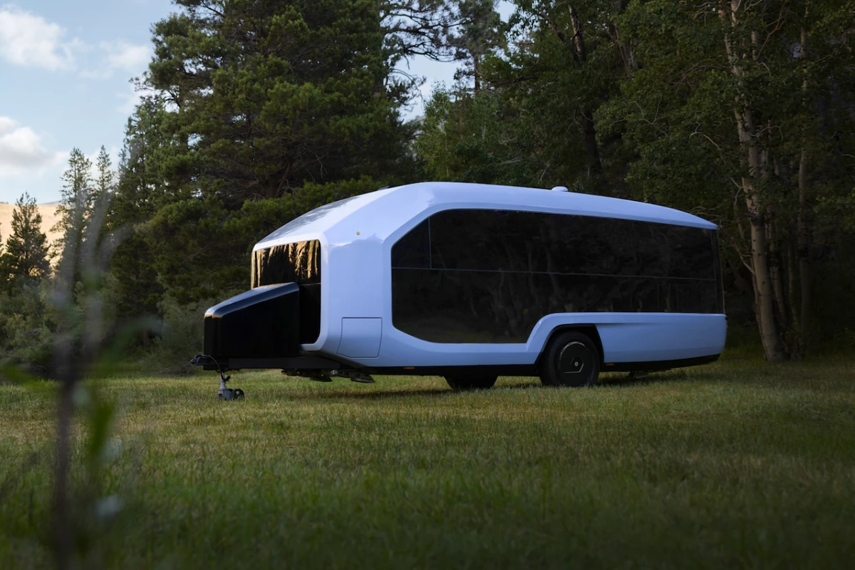 The Pebble Flow smart trailer features a sleek, simple design with windows all over to connect occupants with nature