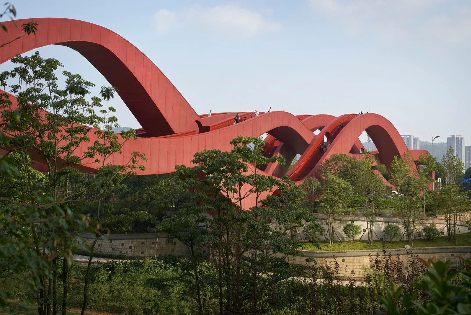 The Lucky Knot bridge comprises three undulating, intertwined steel walkways