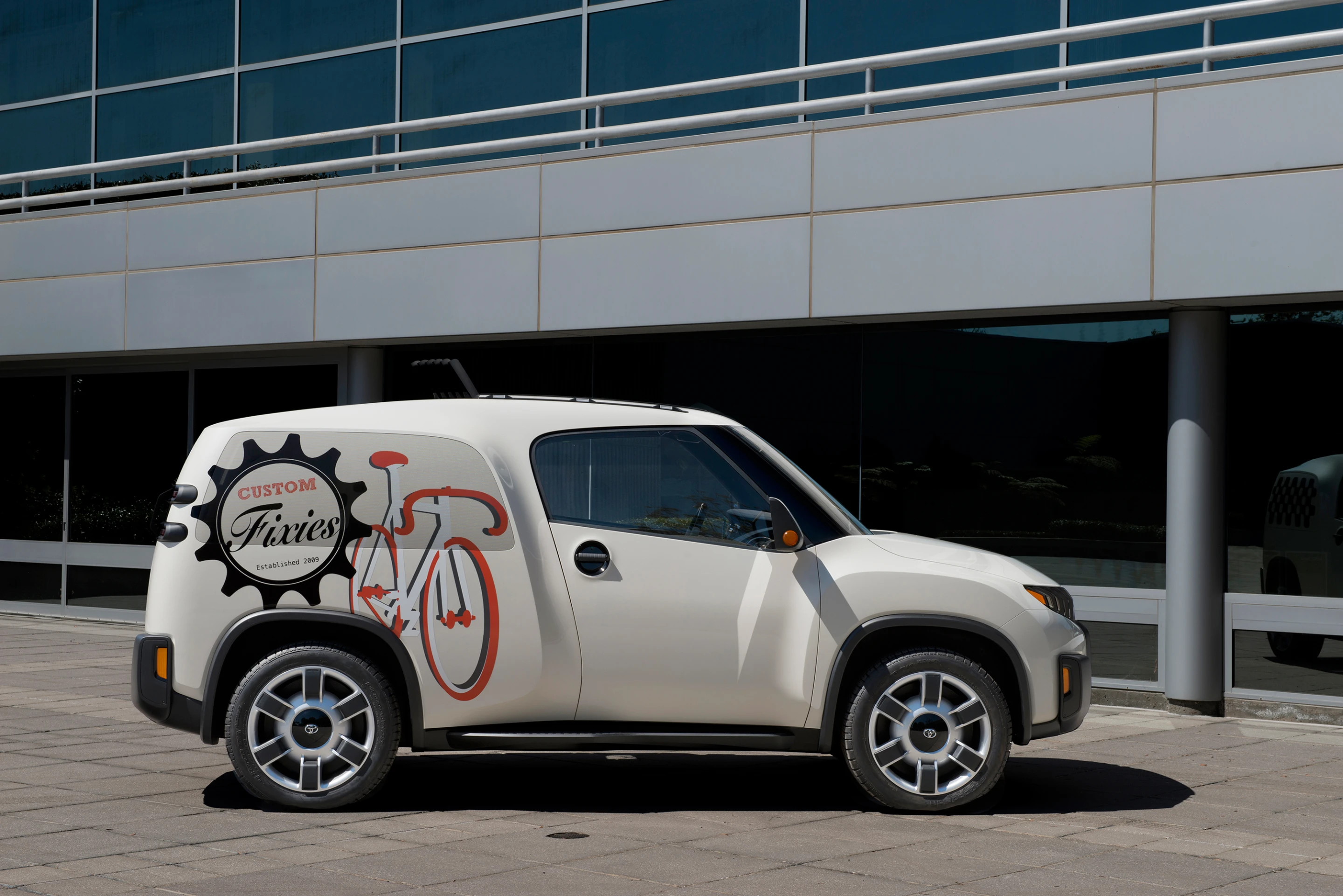 The Urban Utility concept vehicle's rear panel windows pivot up and out of the way