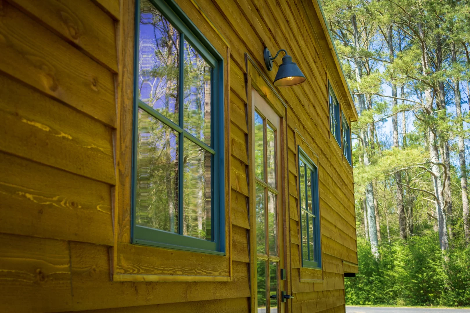 The Cedar House features blue accented windows