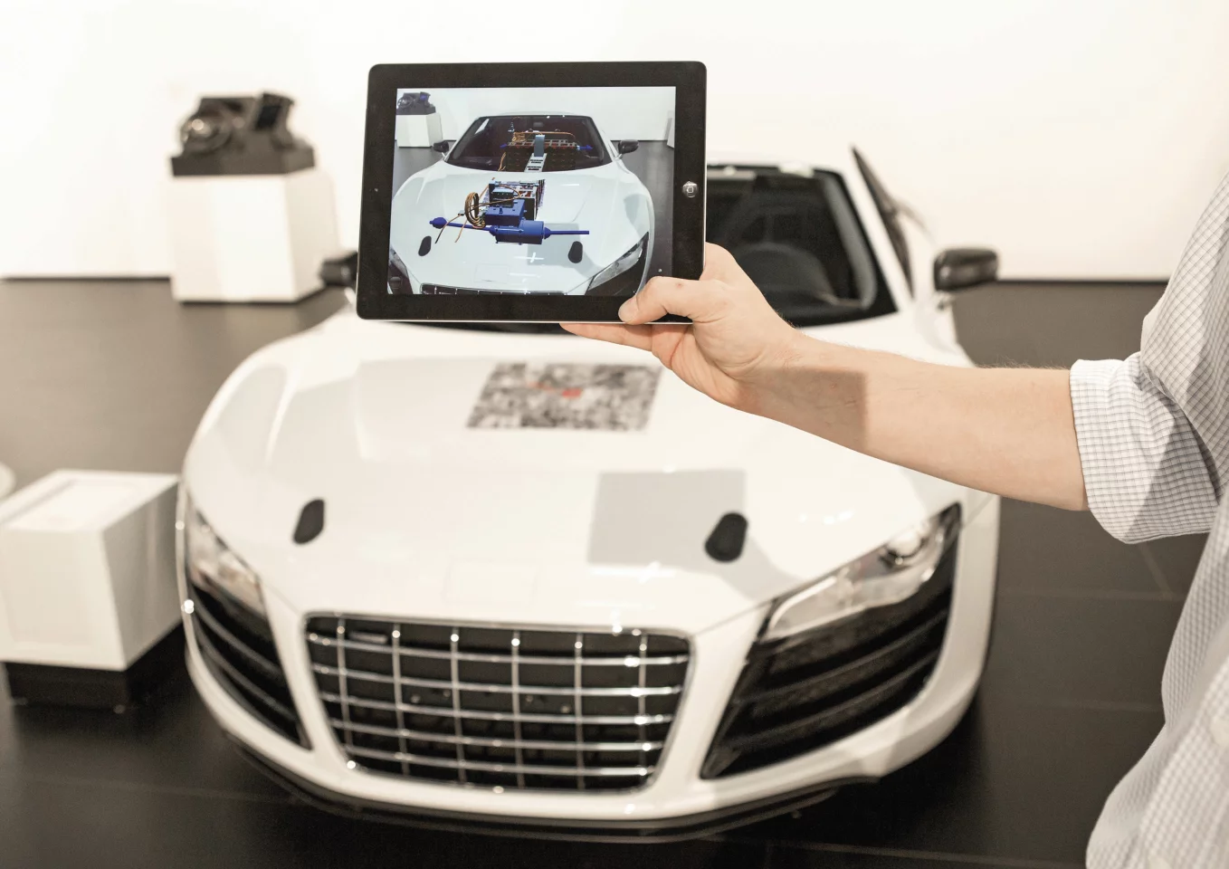 Various F12 operations can be controlled by a removable tablet that fits into the center console