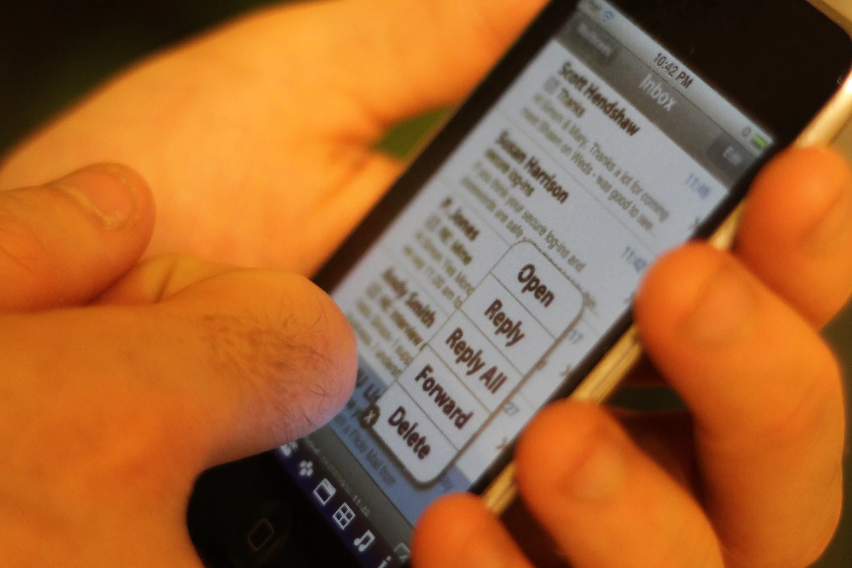 An example of a TapSense email app, in which a knuckle tap on an email heading brings up a list of options instead of opening the message