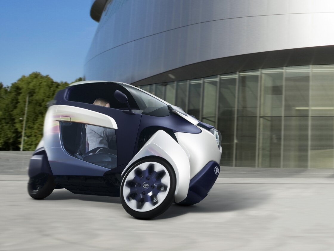 Toyota's i-ROAD is a fully-enclosed, two-seater, three-wheeled, fully-electric, Personal Mobility Vehicle (PMV)