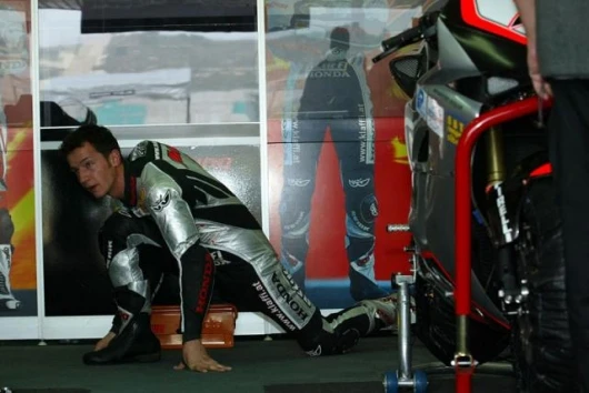 Neukirchner stretches his new leathers prior to race two